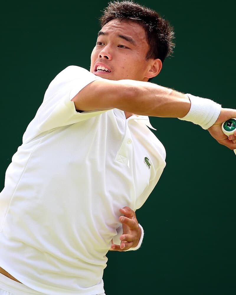 Mu Tao hitting a forehand.